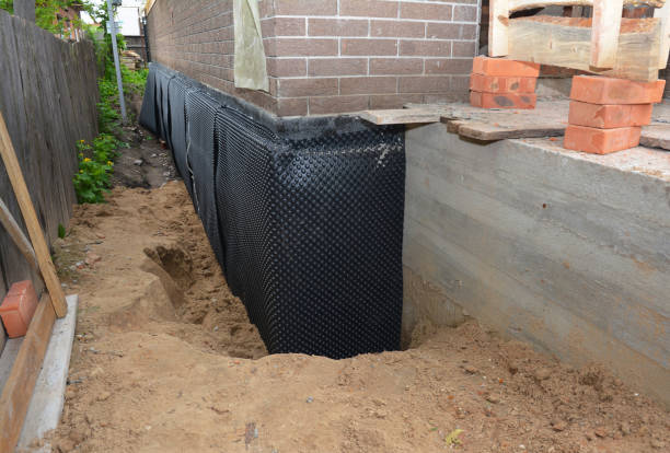 Happy homeowners after waterproofing job in Casnovia